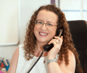 Different Strokes staff member answering a phone
