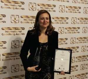 Survivor Katalin receiving a professional award