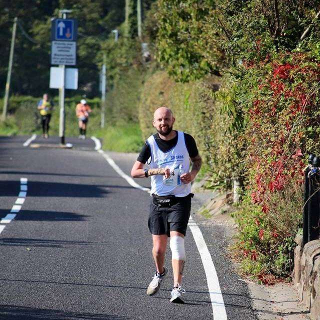 Picture of Jeremy running to aid his recovery, years after he survived a haemorrhagic stroke at just four years old causing right sided hemiplegia and aphasia