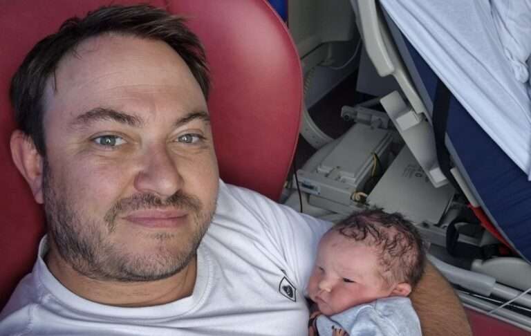 Mike who survived a haemorrhagic stroke in September 2025, aged 42 with one of his children