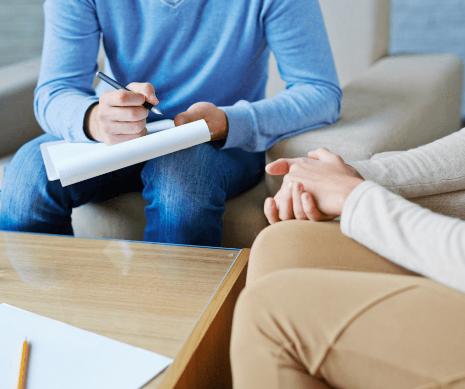 Picture of a professional talking with a stroke survivor about changing careers